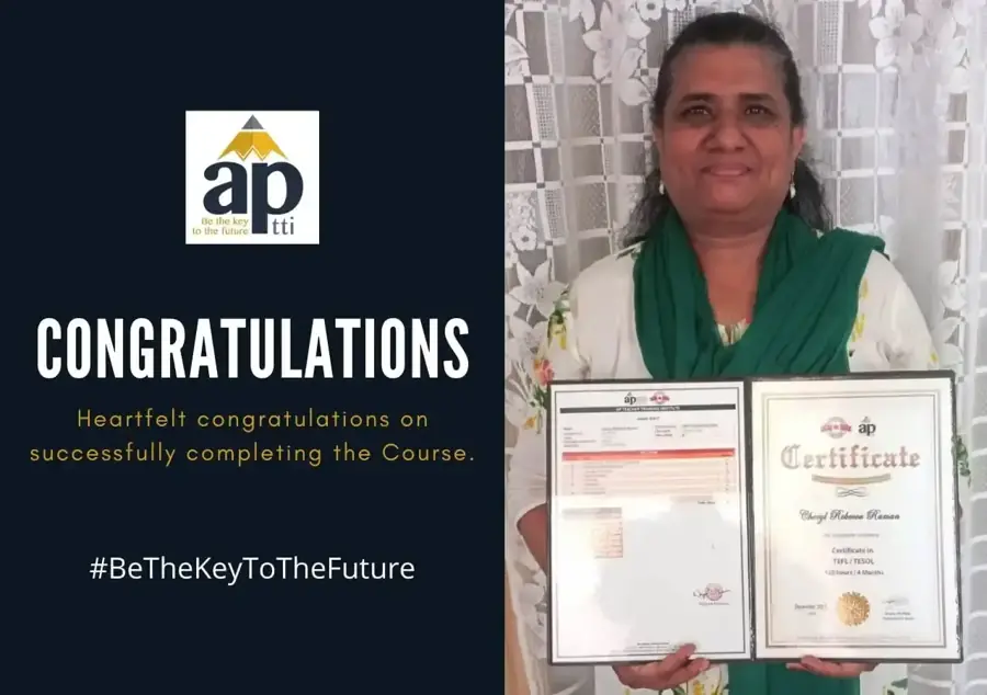An APTTI graduate holding her certificate and grade sheet